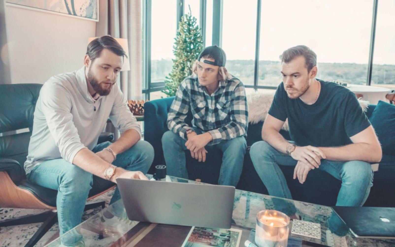 Team meeting discussing financial insights with charts displayed on screen
