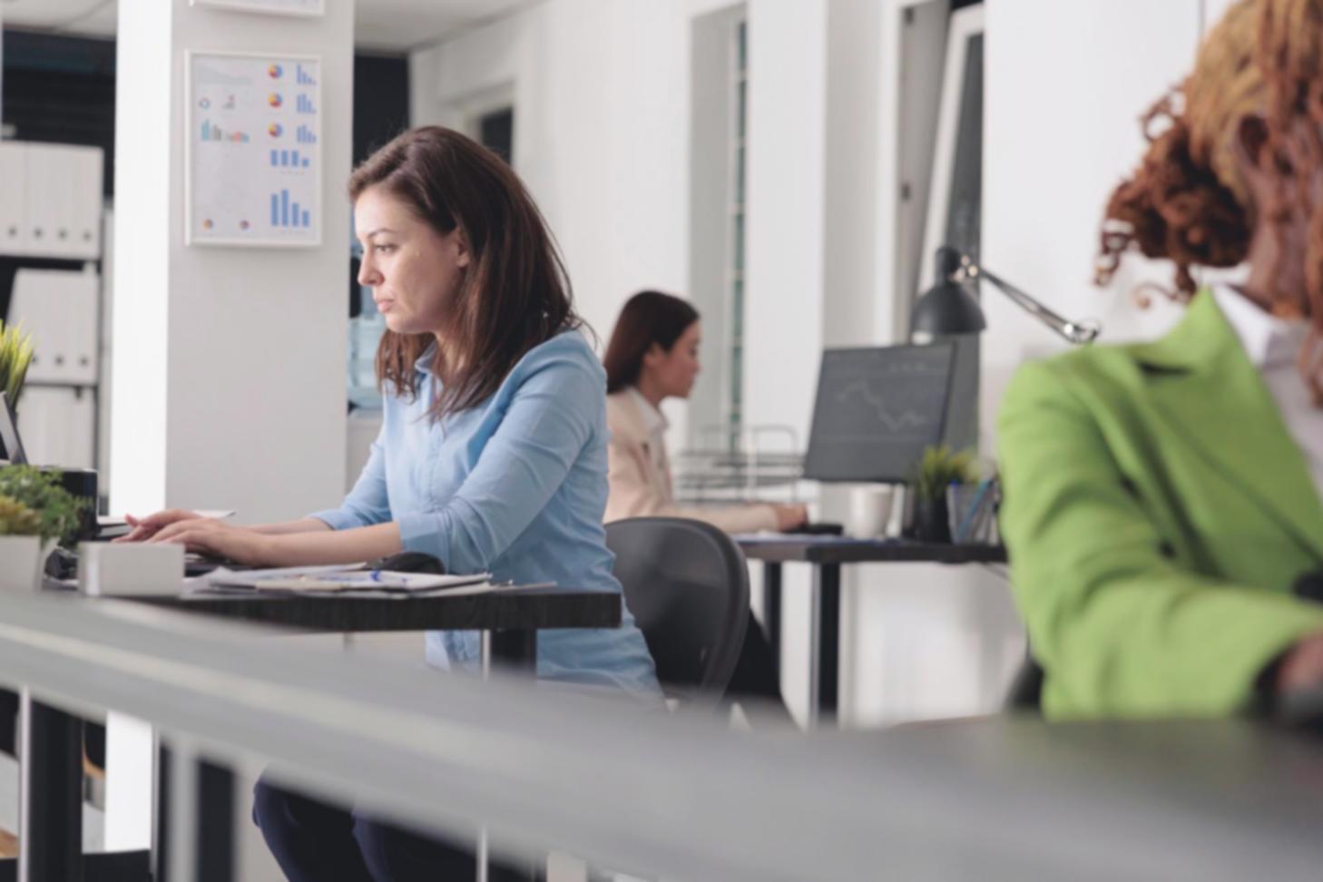 Professional working with financial charts and analytical tools